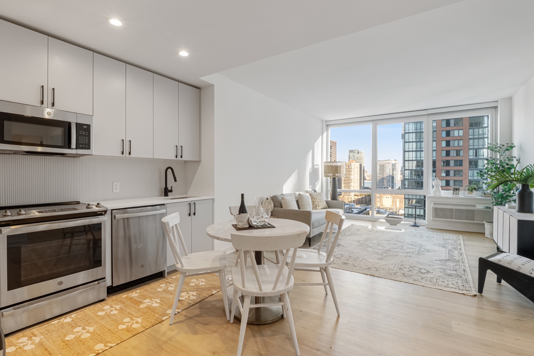 City apartment kitchen and living space with skyline views