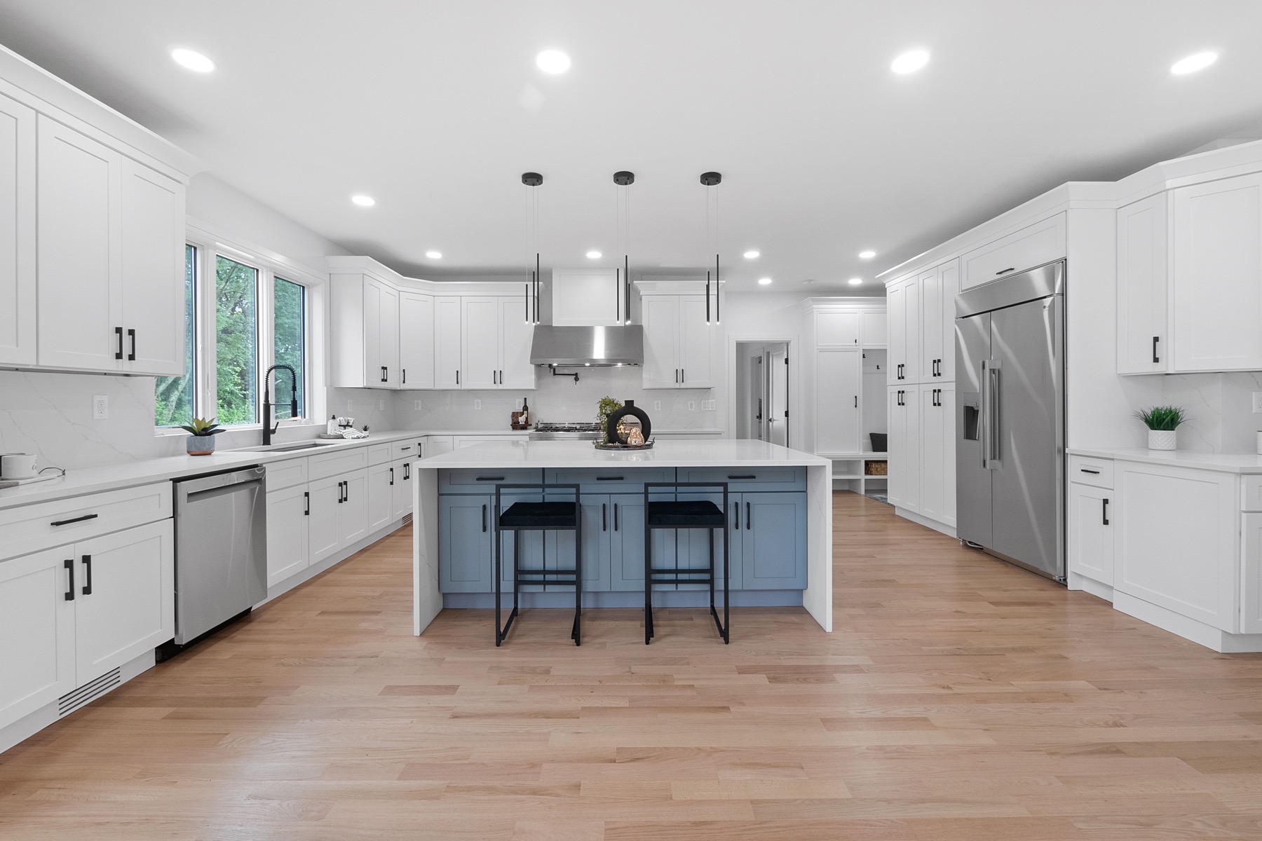 Bright luxury kitchen with a blue island