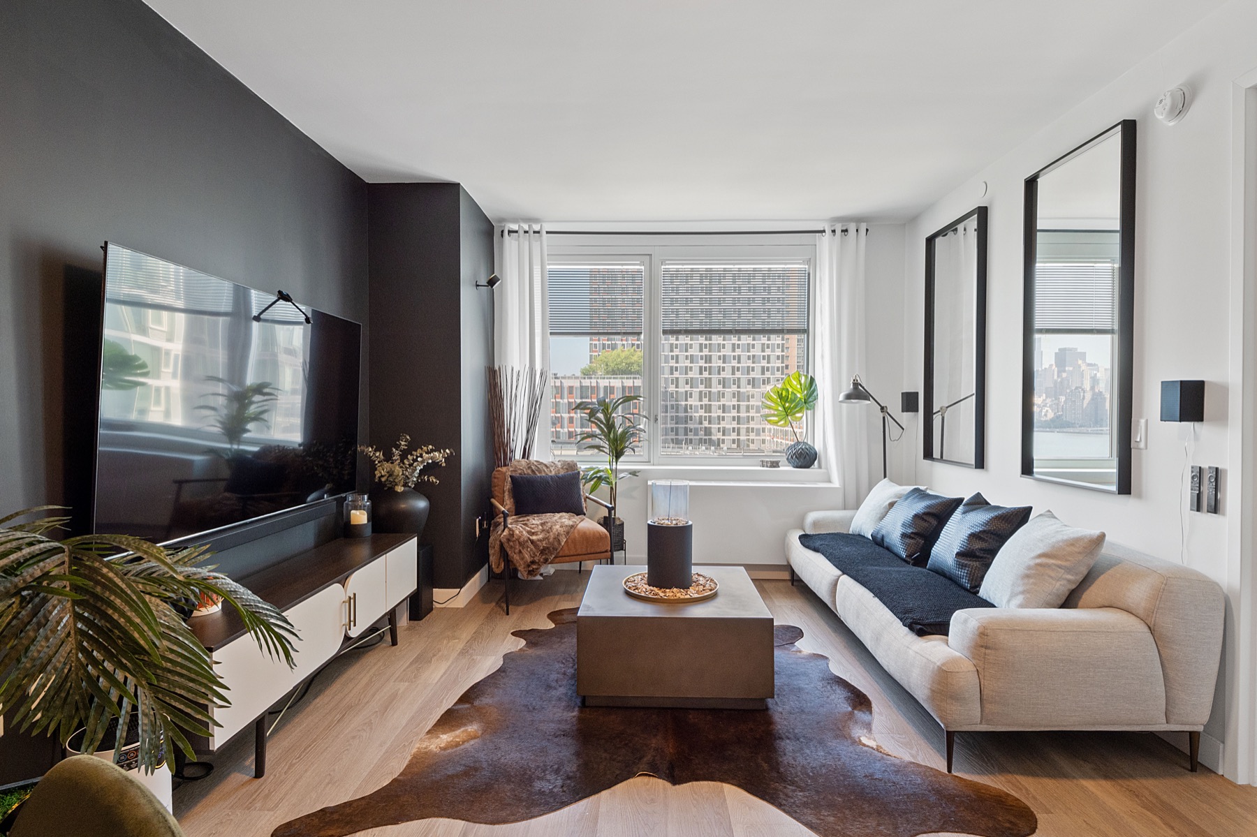 Styled urban living room with a dark feature wall